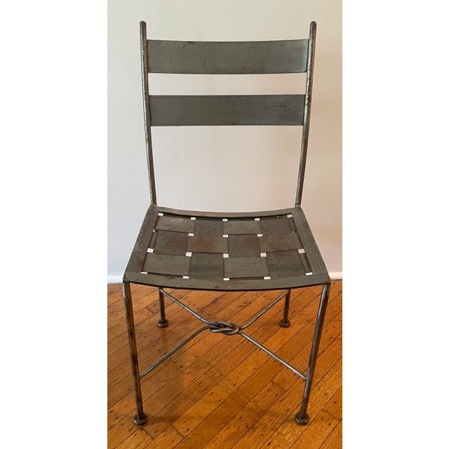 Fantastic pair of designer, handmade iron patio chairs. Several joints of masterful hand soldered Iron work compose the...