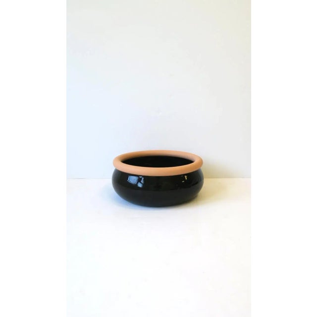 A beautiful black ceramic and terracotta bowl, Postmodern design period, circa late-20th century, 1980s, 1990s. Made in...