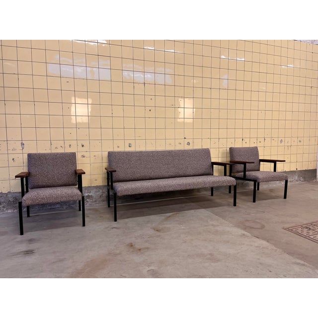 This set of three Belgian-made sofas consists of one two-seater and two armchairs, combining timeless design with modern...