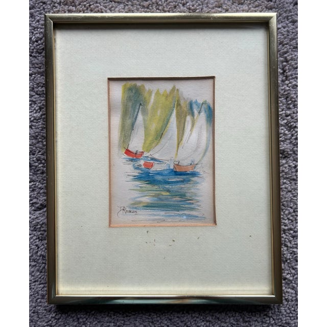 Vintage original watercolor of sailboats in water. In original gold metal frame. Signed ‘D Rhawn’ to the lower left...
