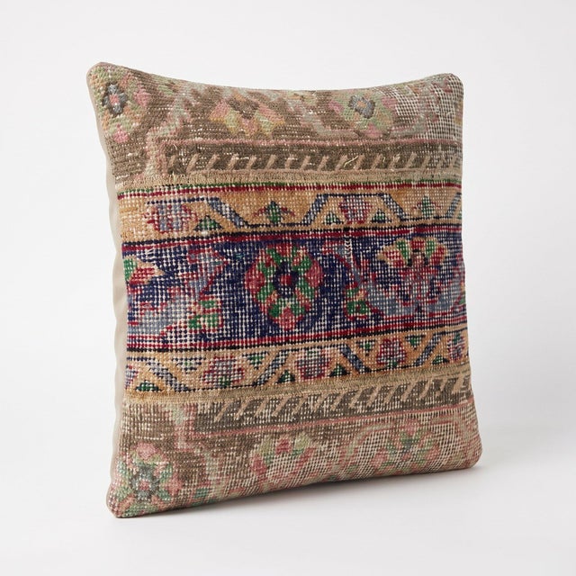 This 20'' x 20'' pillow cover was made from an authentic Turkish rug — navy medallion band with red and green florals....