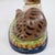 Wonderful recumbent mantle cat painted in folk art whimsical colors. I love the ball in his front paws. Nice large size...