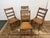 Design Plus Gallery presents a Set of Four Antique Ladder-back Dining Room Chairs from the Victorian Era. The chairs have...