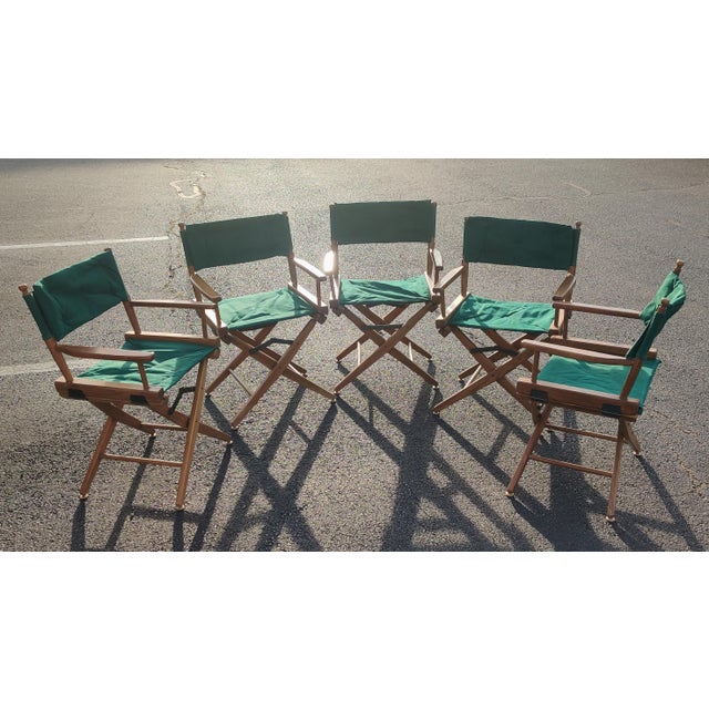 Set of five vintage wood and green fabric folding director's chairs with removable padded fabric backrests. Ask about...