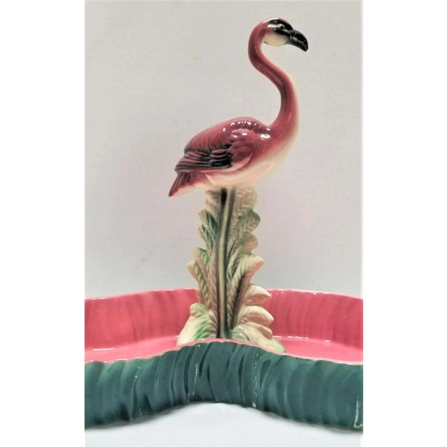 Mid Century pink and green flamingo ceramic figurine in flamingo pool tray decorative bowl. Maddux of California was a...