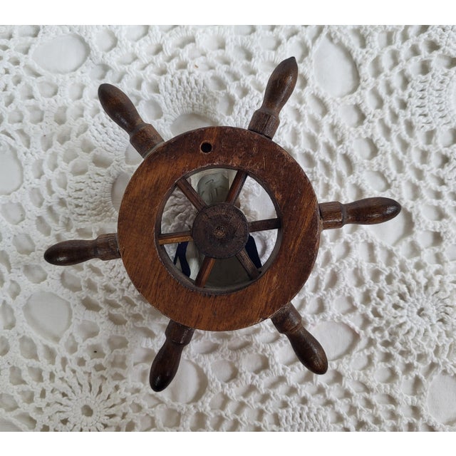 A fun sailor wall hanging measuring 4 1/2" x 5" x 1". This would also look great tucked in a bookshelf.