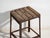 This antique industrial stool in pine wood and iron is an industrial seat with a tubular iron frame and a pine slatted...