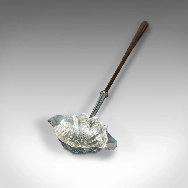 This is an antique double lip toddy spoon. An English, silver serving ladle, dating to the Georgian period, hallmark for...