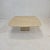 Very nice Italian coffee or side table handcrafted out of travertine, 1980s. The top is rounded on the edge. It is made of...