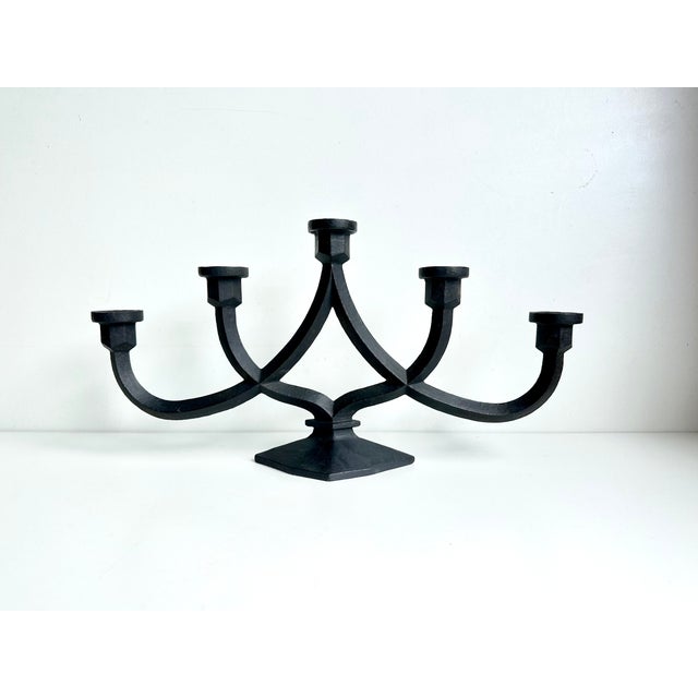 Sculptural five-flame candlestick made of heavy cast iron, crafted in 1967 at the experimental foundry of the renowned...