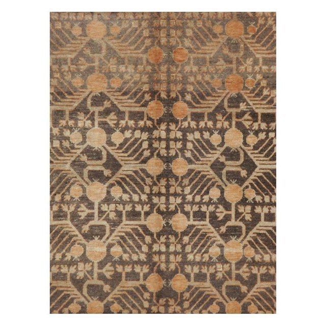 An antique East Turkestan Khotan gallery carpet handmade during the early 20th century. Measures: 6' 8" x 13' 1".