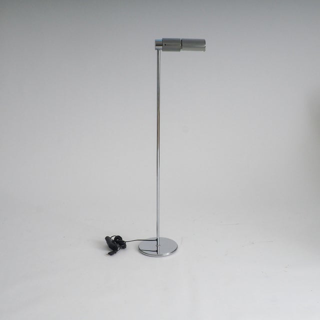 The haloprofil 878hr floor lamp in silver. Bring a piece of swiss precision and 1970s architectural flair into your space...