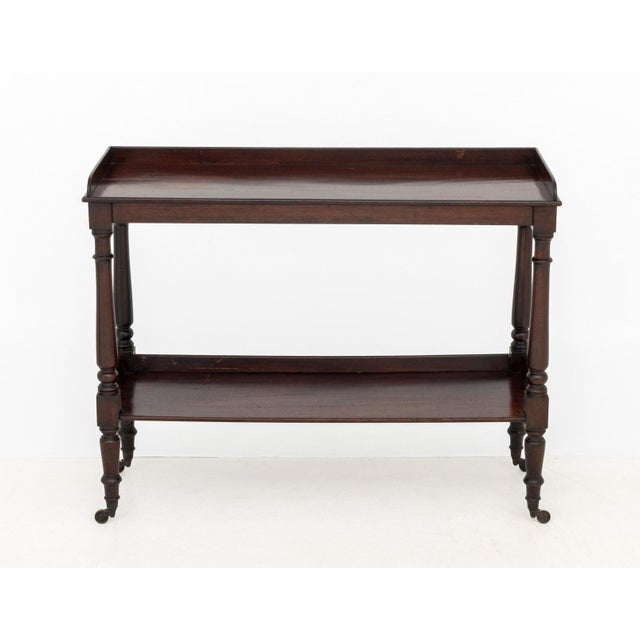 Victorian Mahogany Buffet Table, 19th century, upper gallery edge, undertier, turned wood legs on casters. 38" H x 48" W x...