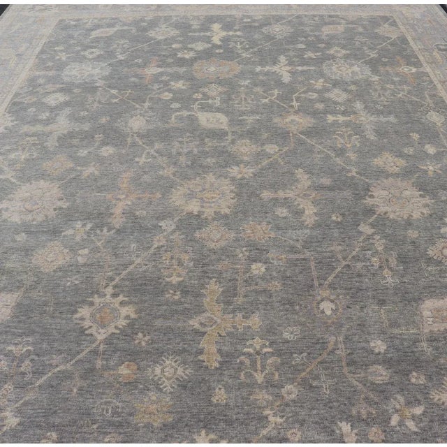 Large Hand-Woven Indian Large Oushak Hand Knotted Wool Rug by Keivan Woven Arts Measures 11'10 x 15'2 This modern Oushak...