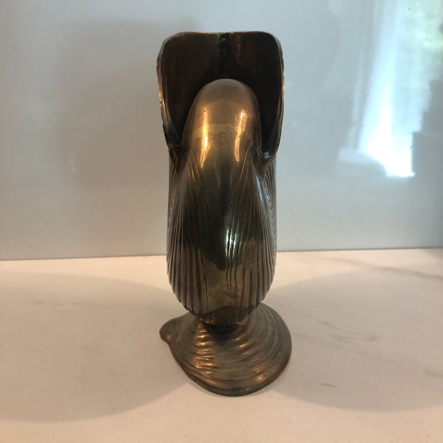 This lovely 1970s Brass Conch Shell Footed Planter from India will be a nice addition to any traditional or coastal home...