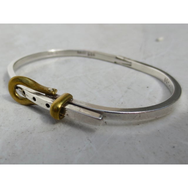 Sterling silver hallmarked to the inner surface TC 99 Mexico Sterling. The length is 6.25" and 3mm wide. The weight is 8.1...