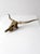 This vintage mid-20th century wall-mounted longhorn steer skull sculpture is cast in brass with a stylized form and...