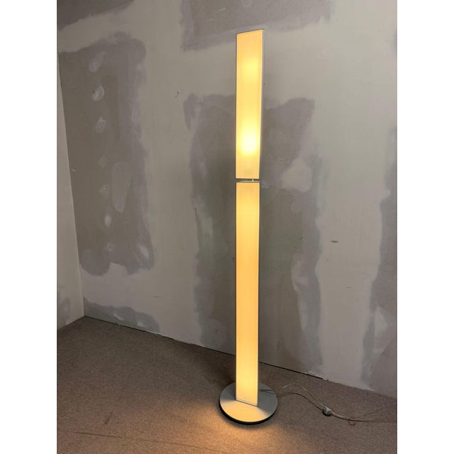 Artificia Stilla modular floor lamp in a striking column design with a decorative pleated look and rotating light elements...