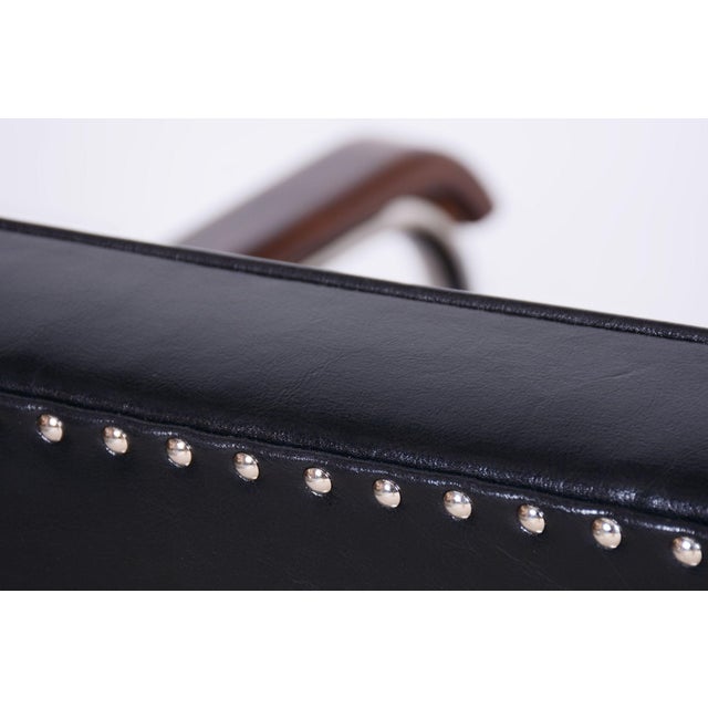 A pair of iconic Bauhaus armchairs from the early 20th century, crafted by the renowned Czechoslovak company Mücke Melder....