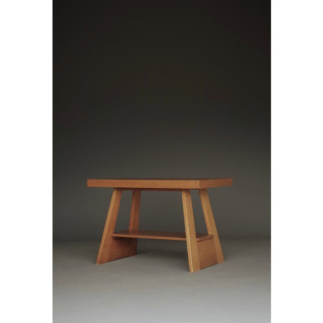 A small simple and stylish oak side table or coffee table, in post war reconstruction style.