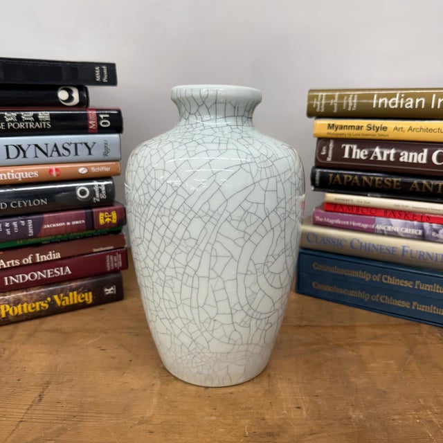 "About This Piece About This Piece Bring a sense of quiet movement into your space with this vase, where a luminous white...