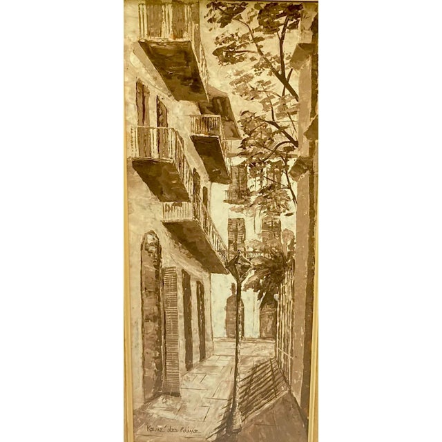 Sepia painting depicting a French village in a faux wood frame.. Framed with gold leaf molding between frame and matte and...