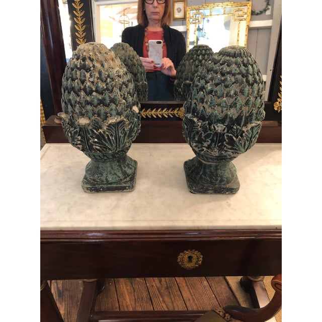 Timeless pineapple motife cast cement finials or acorns having marvelous aged and verdigris patina. The imperfections...