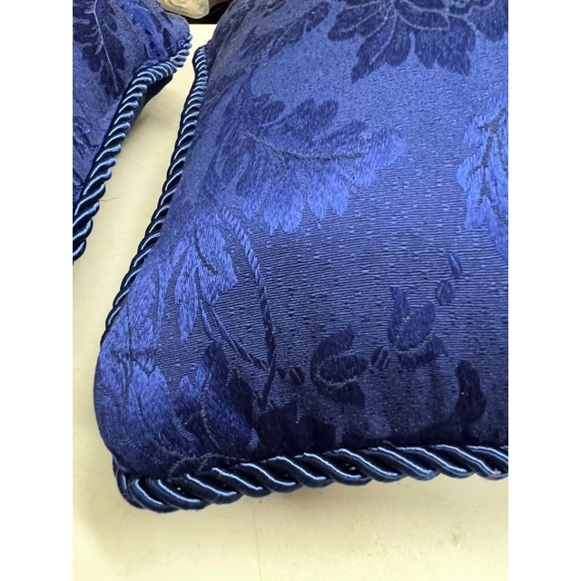 Pair of 2 square pillows. Floral damask design. Square shape measuring 15” x15” trimmed with large blue rope.