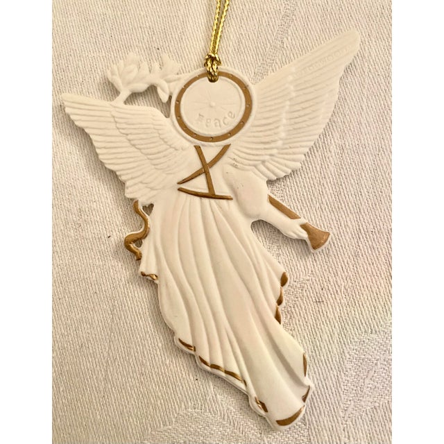 Vintage Wedgwood White Jasper Angel ornament, featuring a gold-toned horn, 22k gold accents, and its original blue and...