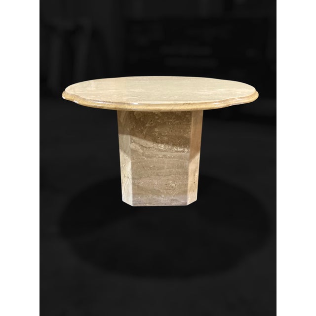 Italian travertine is shaped into soft undulating contours and an organic, cloud-like form in these 1970s scalloped-edge...