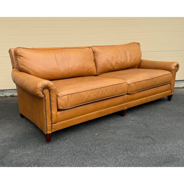 Ralph Lauren Macintyre sofa in leather camel with down wrapped cushions on mahogany legs.