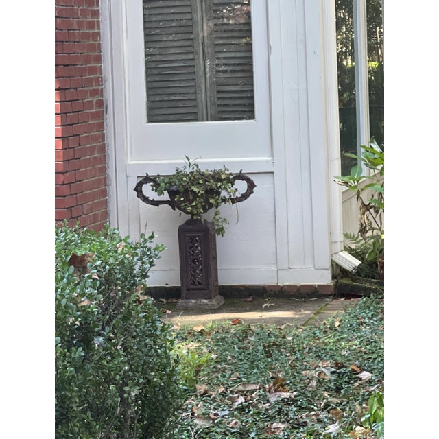 Elegant American Victorian Floor Model urn planter fabricated of cast metal. Attributed to J.W. Fiske and Company, the...