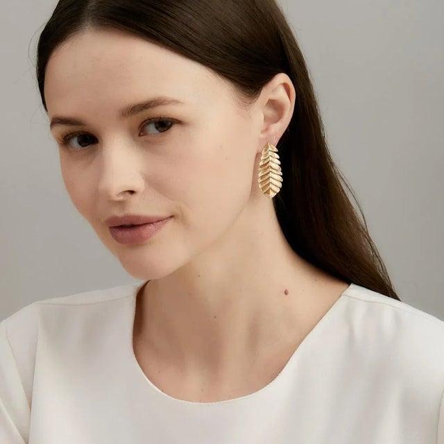 Created in 18 karat yellow gold Diamonds 1.35 carats approx. Post backs for pierced ears About the Designers Drawing...