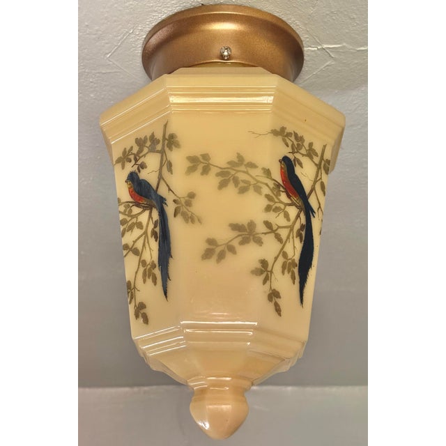 Eight-sided custard glass shade with original painted birds and leaf pattern is a fine 1920s piece, brought into the...