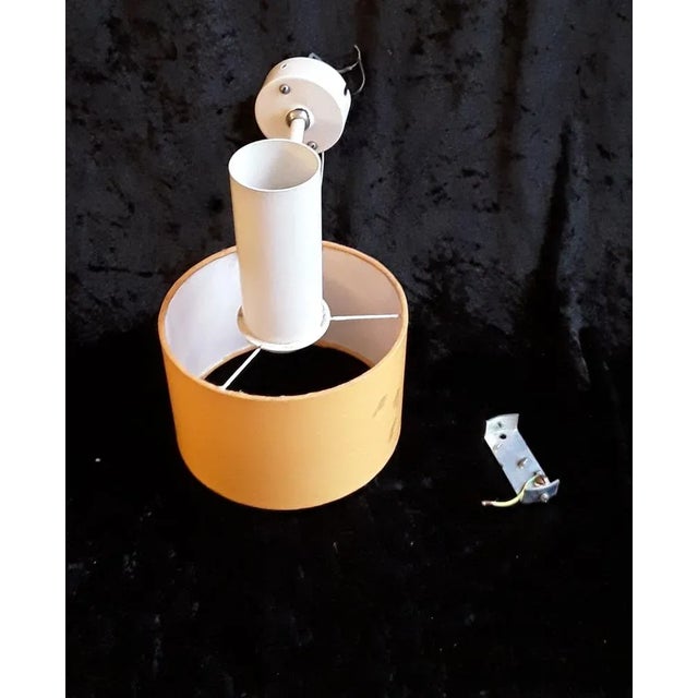 Vintage Cream Colored Metal Adjustable Wall Light with Orange Fabric Screen, 1970s, in Good conditions. Designed 1970 to...