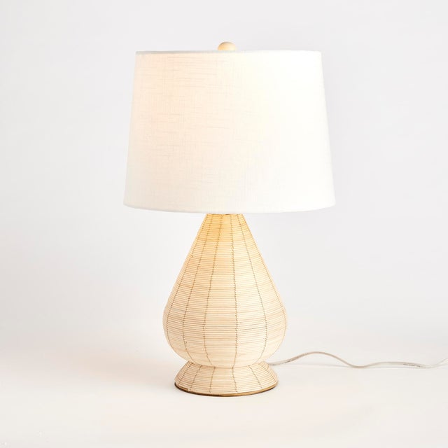 Woven in aWhitewash cane rattan, with subtle variations in color that makes each one truly unique, this lamp is an instant...