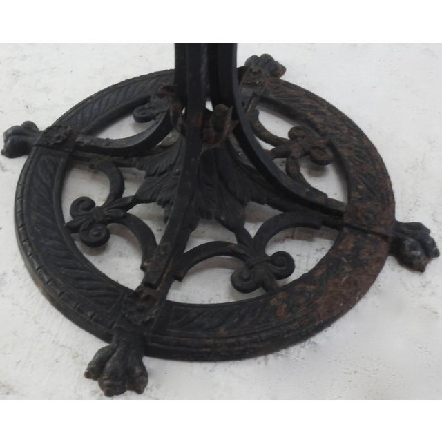 Classic fleur de lis pattern is on the base of this hand-forged wrought iron plant Stand. The center column is made up of...