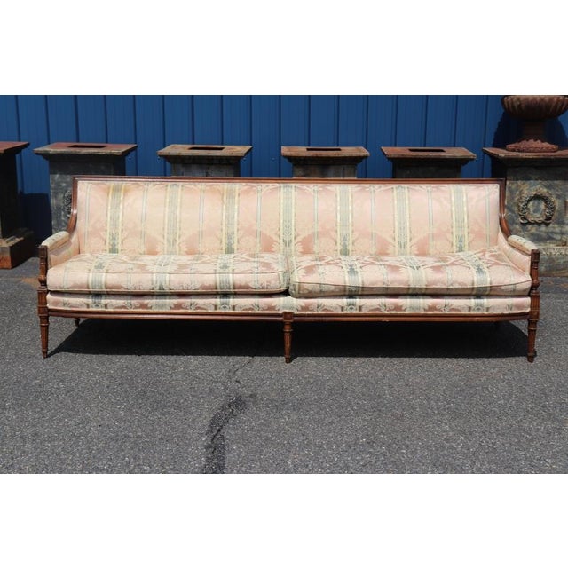 Add timeless elegance to your home with this antique French Louis XVI sofa, a refined example of 19th to early 20th-...