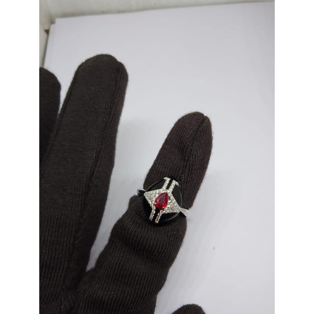 Ruby: 0.45cts Diamond: 0.24cts 18K gold Gold weight: 5.32 grams Gross weight: 5.46 grams We encourage you to examine all...