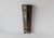 A Mid-century brass and other metal umbrella stand that features an elegant half-hexagonal shape with intricate decorative...