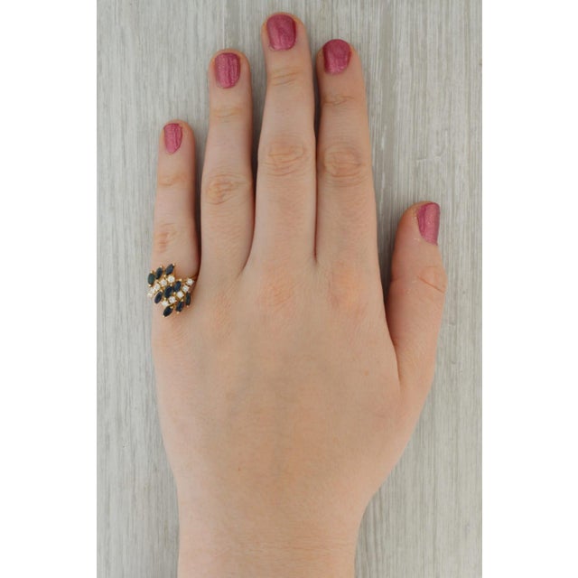 Gemstone Information: - Natural Sapphires - Total Carats - 2ctw Cut - Marquise Brilliant Color - Dark Blue Treatment -...