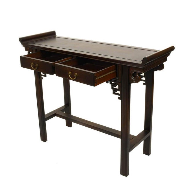 Elegant in form and restrained in ornament, this Chinese two-drawer altar table offers a refined interpretation of...