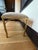 Elegant and versatile, this upholstered bench features a refined brass-finished metal frame with graceful sabre style legs...