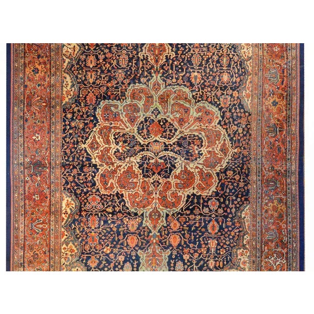 An extraordinary early 20th century Persian Sarouk Farahan rug with a wonderfully woven abstract medallion woven in myriad...