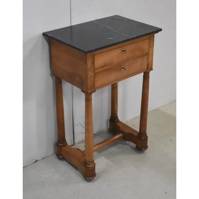 Elegant Small Service Cabinet of the Empire Period, made of Solid Cherry. A Bewitching Black Marble with White veins...