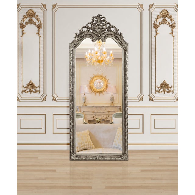Create an unforgettable focal point with this grand oversized full-length mirror, featuring an elaborately sculpted...