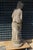 This is a one-piece statue. The depiction shows a half-naked woman. The base is round and firmly incorporated into the...