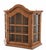 Vintage wall-mounted oak curio cabinet featuring an architectural arched crown, divided transparent panels, angled sides,...