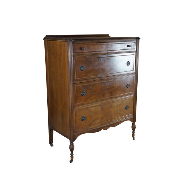 This 1930s Federal-style chest of drawers showcases classic revival elegance, highlighted by its striking book-matched...