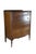 This 1930s Federal-style chest of drawers showcases classic revival elegance, highlighted by its striking book-matched...